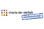 Das Logo der Charta der Vielfalt zeigt 9 zweifarbige Kugeln und den Schriftzug "Charta der Vielfalt – Für Diversity in der Arbeitswelt"